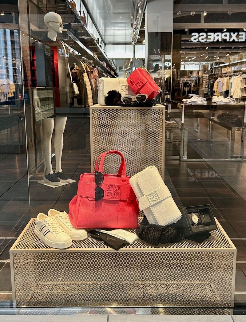 Window riser with red handbag and accessories